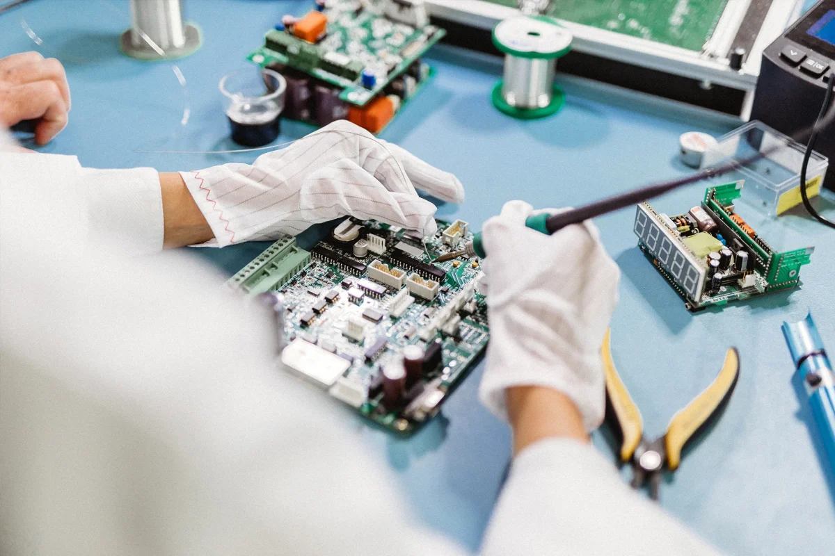 Engineer soldering circuit board