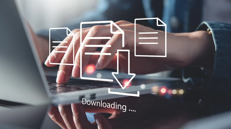 Business man downloading computer files or installing software on laptop computer, cloud storage technology, data backup, cyber security, document downloading